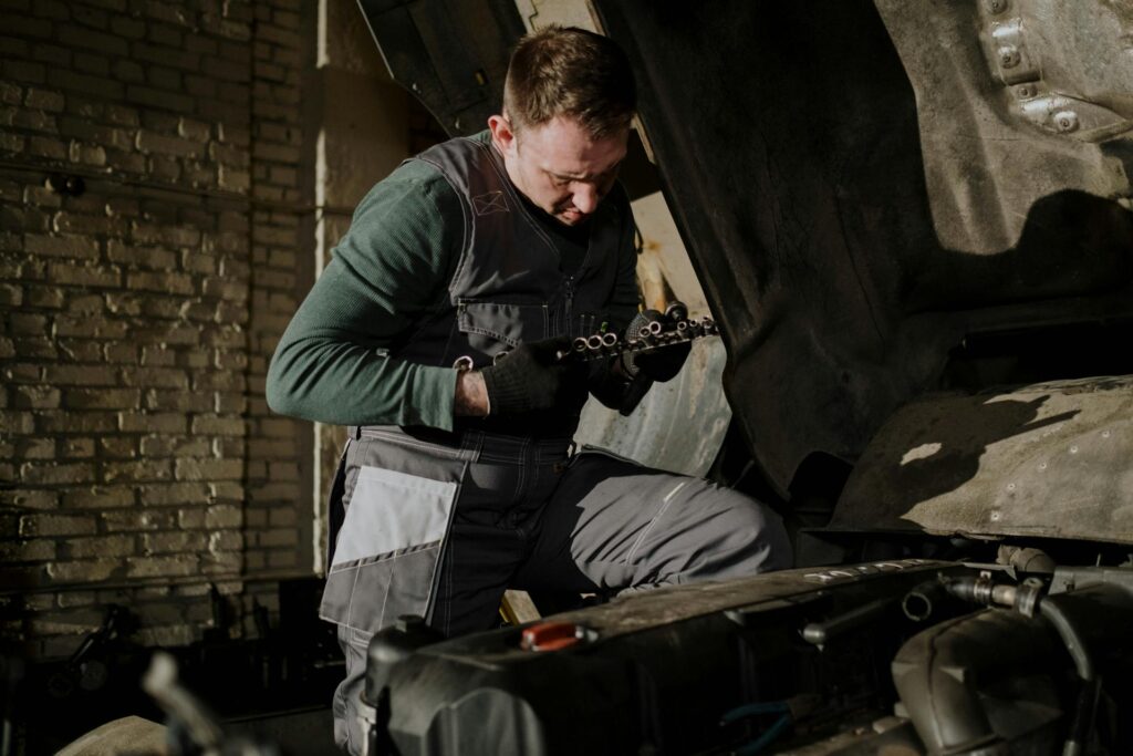 a professional mechanic repairing car.